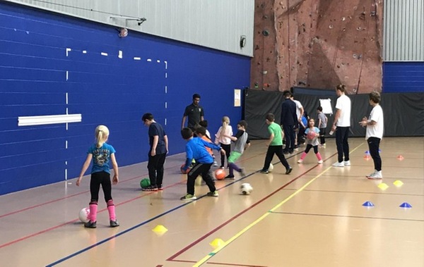 Children playing soccer training in the LCCC winter soccer academy.