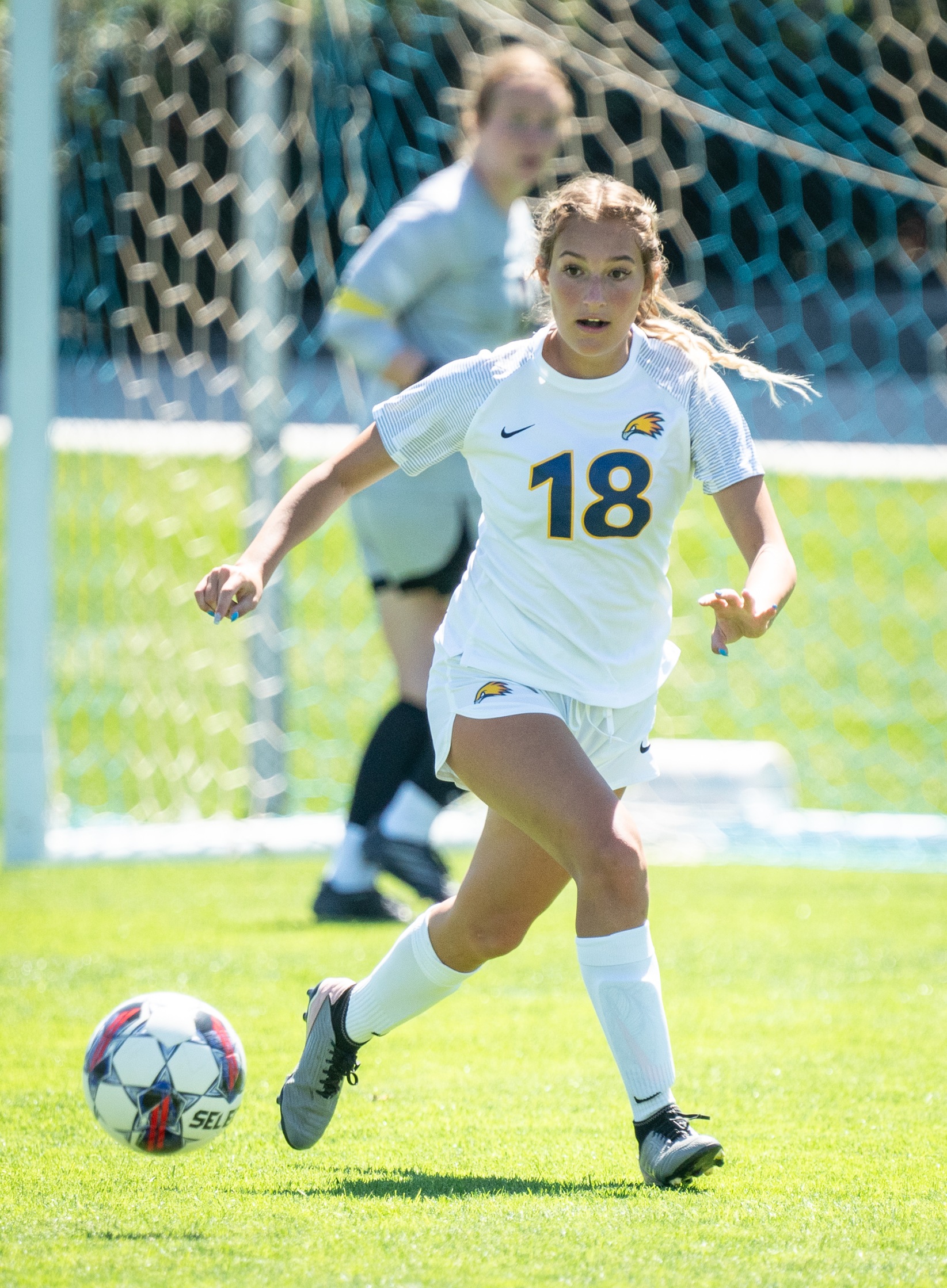 Adelaide Gonzales dribbling a soccer ball